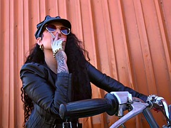 Milf dominates a naked man in a bdsm session