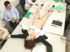 Asian business woman stripped in the office