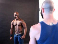 Ebony hunk cocksucking during photo shoot
