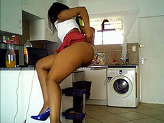 dark-hued girl with yummy donk teasing in kitchen