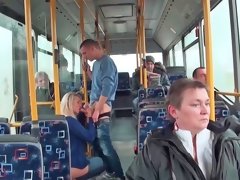 Anal sex is happening in the bus next to some people