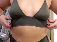 Plump gal tries on thongs